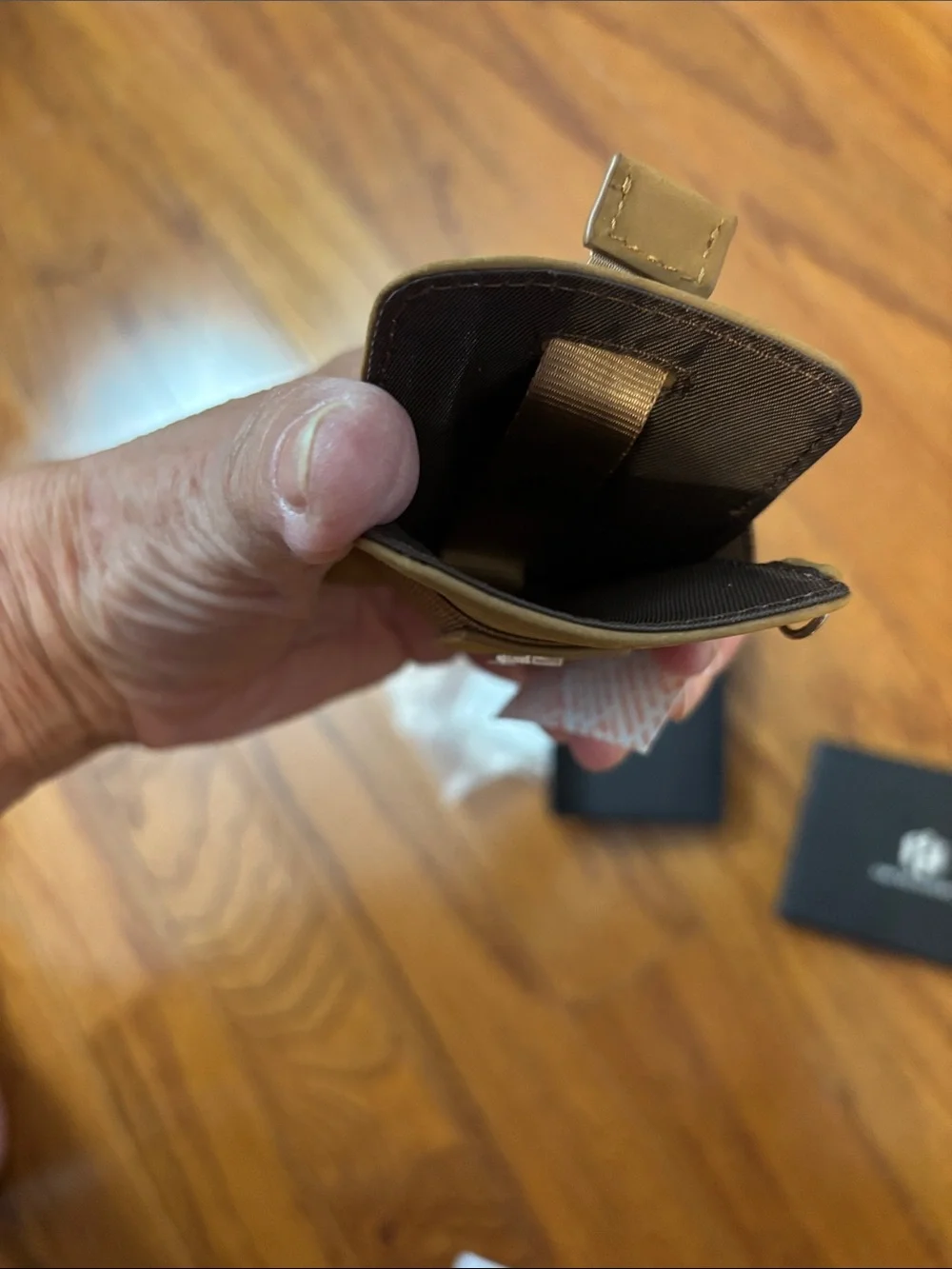 Men's wallet holds 12 cards and has a money clip